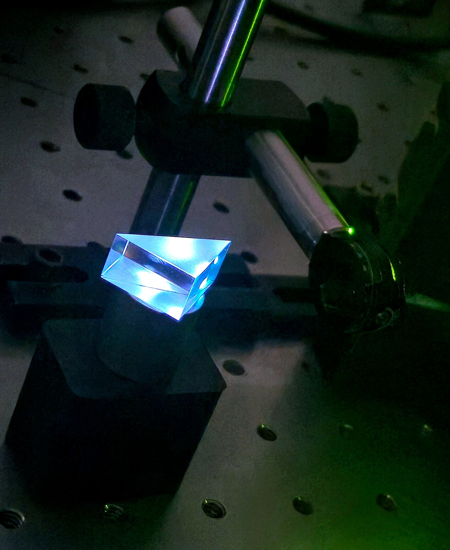 Deep-UV laser light visible in a prism