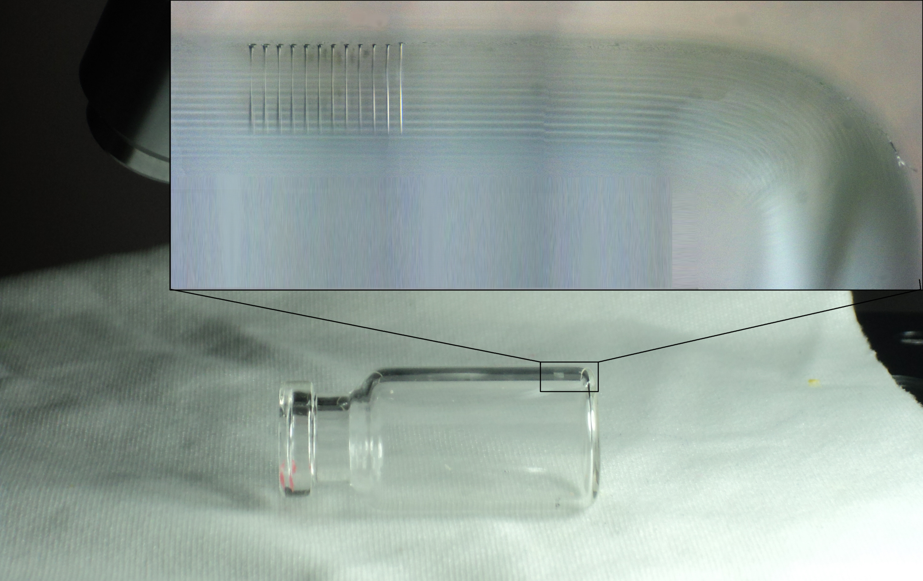 High-aspect ratio holes drilled in glass vial.